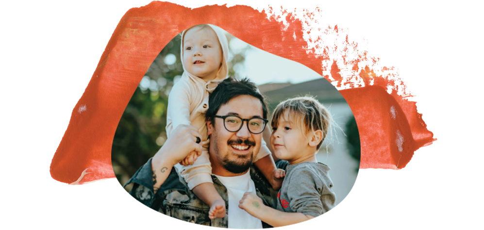 A person wearing glasses holds two children, their smiles radiating warmth against the red brushstrokes that evoke the vibrant spirit of Peoria AZ.